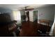 Bedroom featuring wood floors, windows, and doorway at 6109 Cora St, Charlotte, NC 28216