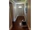 Inviting hallway with hardwood floors and neutral walls; a great entryway into the home at 6109 Cora St, Charlotte, NC 28216