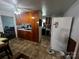 Kitchen featuring wood cabinets and tile floors at 6109 Cora St, Charlotte, NC 28216