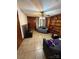 Cozy living room featuring a ceiling fan, built-in bookshelves, and comfortable seating at 6109 Cora St, Charlotte, NC 28216