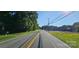 A sunny day view of street at 619 N Main St, Landis, NC 28088