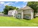Back exterior view of the home featuring a lush green lawn at 6619 Bittinger Ct, Charlotte, NC 28216