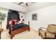 Inviting bedroom with dark wood furniture, a ceiling fan, and carpeted floors at 6619 Bittinger Ct, Charlotte, NC 28216