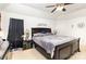 Bright bedroom featuring neutral carpet, a ceiling fan and black-out curtains at 6619 Bittinger Ct, Charlotte, NC 28216