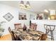 Elegant dining space showcasing a patterned table, wooden chairs, and view into the adjacent room at 6619 Bittinger Ct, Charlotte, NC 28216