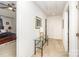 Upstairs hallway with neutral carpet, leading to various rooms with doorways at 6619 Bittinger Ct, Charlotte, NC 28216