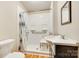 Accessible bathroom with walk-in shower, safety bars, and white sink and toilet at 814 Grace St, Kings Mountain, NC 28086