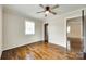 Bedroom with hardwood floors, ceiling fan, and interior door at 814 Grace St, Kings Mountain, NC 28086