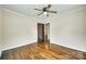 Bedroom boasts hardwood floors, neutral walls, ceiling fan, and adjoining room at 814 Grace St, Kings Mountain, NC 28086