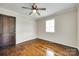 Bedroom with hardwood floors, ceiling fan, and a window with natural light at 814 Grace St, Kings Mountain, NC 28086