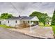 Charming single-story home with white siding, a covered parking area, and a handicap accessible ramp at 814 Grace St, Kings Mountain, NC 28086