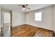 Cozy living room featuring beautiful hardwood floors, neutral walls, and a ceiling fan for added comfort at 814 Grace St, Kings Mountain, NC 28086