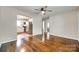 Open living area with gleaming hardwood floors, seamlessly connecting to a bright kitchen for modern living at 814 Grace St, Kings Mountain, NC 28086