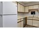 Bright kitchen featuring white appliances and sleek, modern design at 825 21St Ne Ave, Hickory, NC 28601