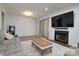 Open living room featuring a fireplace, sliding glass door to enclosed porch, and neutral colors at 825 21St Ne Ave, Hickory, NC 28601
