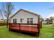 Inviting backyard with a spacious wooden deck, perfect for outdoor entertaining and relaxation at 828 Saint Andrews Pl, Concord, NC 28025