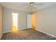 Comfortable bedroom featuring plush carpeting and a ceiling fan for added comfort and style at 828 Saint Andrews Pl, Concord, NC 28025