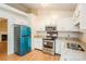 Bright kitchen boasts stainless steel appliances, granite countertops, and white cabinets at 828 Saint Andrews Pl, Concord, NC 28025