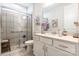 Bathroom with a walk-in shower and white vanity, providing accessibility and a refreshing space at 8516 Profit Ln, Charlotte, NC 28215
