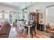 Cozy dining area with wood floors, chandelier, and a decorative china cabinet at 8516 Profit Ln, Charlotte, NC 28215