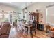 Cozy dining area with wood floors, chandelier, and a decorative china cabinet at 8516 Profit Ln, Charlotte, NC 28215