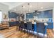 Well-designed kitchen island with seating, modern lighting, and ample storage space, great for entertaining at 8516 Profit Ln, Charlotte, NC 28215