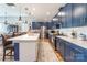 Modern kitchen with stylish countertops, stainless steel appliances, and sleek blue cabinetry at 8516 Profit Ln, Charlotte, NC 28215