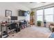 Bright room with carpet, desk, and large windows, perfect for use as a home office or study at 8516 Profit Ln, Charlotte, NC 28215