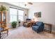 Cozy living room with natural light, plush seating, and a ceiling fan, creating a relaxing atmosphere at 8516 Profit Ln, Charlotte, NC 28215