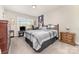 Bedroom features neutral walls, carpet flooring, a window, and furnishings at 9807 Maywine Cir, Huntersville, NC 28078