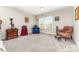 Bright bedroom featuring carpet flooring, a window, and furnishings at 9807 Maywine Cir, Huntersville, NC 28078