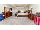 Primary bedroom features a tray ceiling, a large bed, and carpet flooring at 9807 Maywine Cir, Huntersville, NC 28078