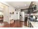 View of the kitchen with stainless steel appliances and dark wood cabinets at 9807 Maywine Cir, Huntersville, NC 28078