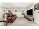 Spacious living room with carpet, natural light, and TV at 9807 Maywine Cir, Huntersville, NC 28078