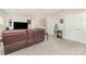 Spacious living room with carpet, natural light, comfortable seating, and wet bar at 9807 Maywine Cir, Huntersville, NC 28078
