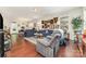 Spacious living room with hardwood floors, plush sofas, and decorative wall art at 9807 Maywine Cir, Huntersville, NC 28078