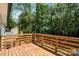 Wooden deck overlooks the expansive backyard, perfect for relaxation and entertaining at 9830 Spring Harvest Dr, Mint Hill, NC 28227