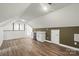 Finished basement with a small bar area and light wood grain flooring at 9830 Spring Harvest Dr, Mint Hill, NC 28227