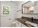 Stylish bathroom features a unique vanity with modern fixtures and a sleek black-framed mirror at 9830 Spring Harvest Dr, Mint Hill, NC 28227