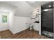 Bright bathroom featuring a tile shower, vanity, and wood grain floors at 9830 Spring Harvest Dr, Mint Hill, NC 28227