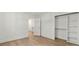 Bedroom showing a walk-in closet, white walls, white trim and wood floors at 9830 Spring Harvest Dr, Mint Hill, NC 28227