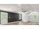 Spacious bedroom with ceiling fan, natural light, and access to outdoor area at 9830 Spring Harvest Dr, Mint Hill, NC 28227