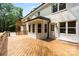 Spacious wood deck and screened in porch on a white brick two story home at 9830 Spring Harvest Dr, Mint Hill, NC 28227