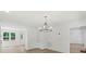 Dining room with wood floors and a modern chandelier at 9830 Spring Harvest Dr, Mint Hill, NC 28227