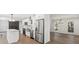 Open kitchen with stainless steel appliances, a large island, and hardwood floors at 9830 Spring Harvest Dr, Mint Hill, NC 28227