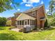 Beautiful brick home featuring a screened porch and well-maintained backyard at 1011 Wadsworth Ln, Indian Trail, NC 28079