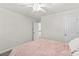 Bedroom with ceiling fan, neutral walls, and lots of natural light at 1011 Wadsworth Ln, Indian Trail, NC 28079