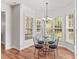Breakfast nook with a glass table, seating for four, and large windows for ample natural light at 1011 Wadsworth Ln, Indian Trail, NC 28079