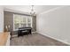 Finished flex room features wood accent wall and lots of natural light at 1011 Wadsworth Ln, Indian Trail, NC 28079
