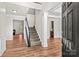 Spacious foyer featuring hardwood floors, staircase, and elegant architectural details at 1011 Wadsworth Ln, Indian Trail, NC 28079